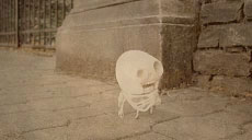 small skeleton puppet on the street